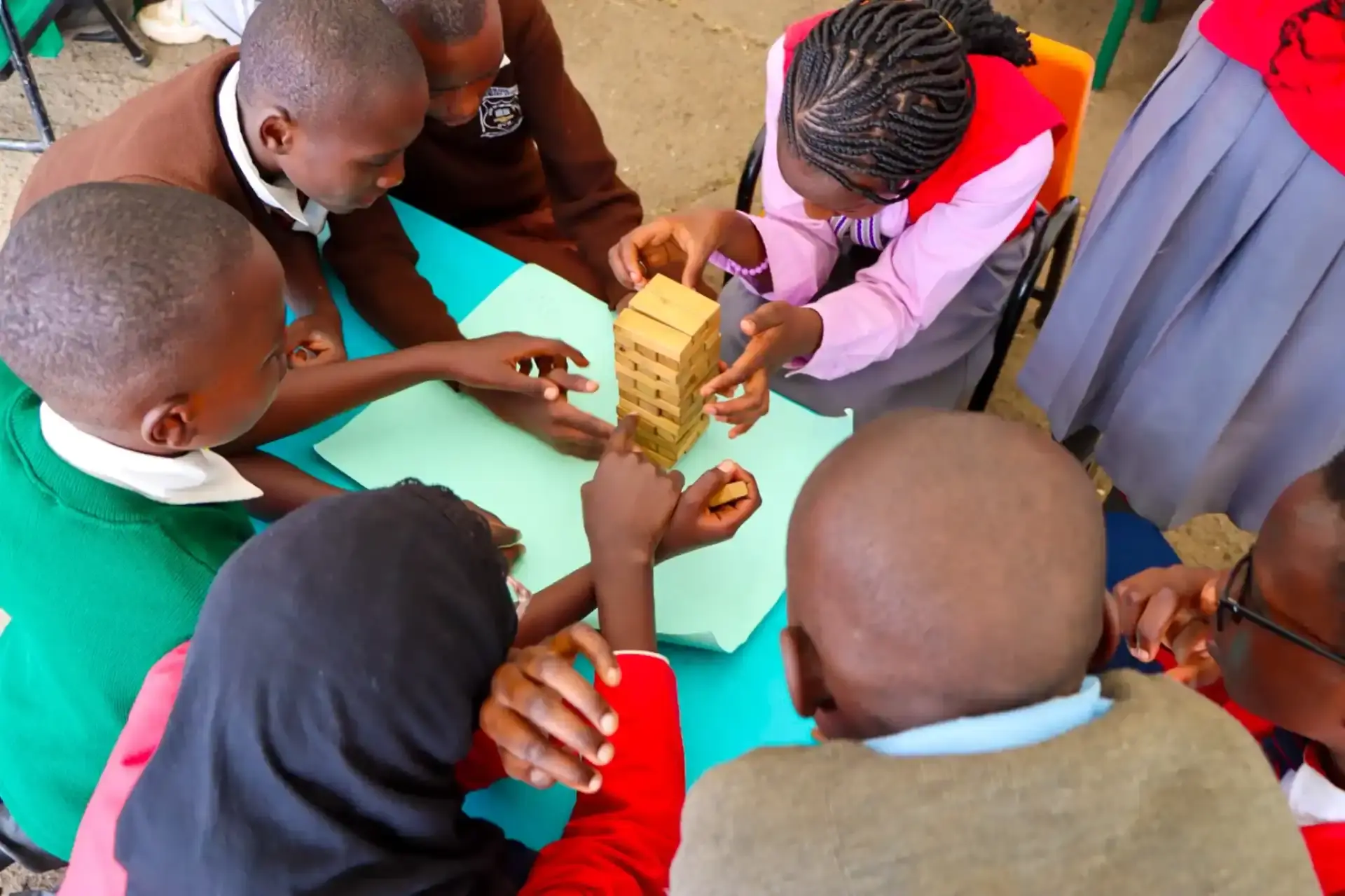 Children playing together at a Mizizi Elimu community event