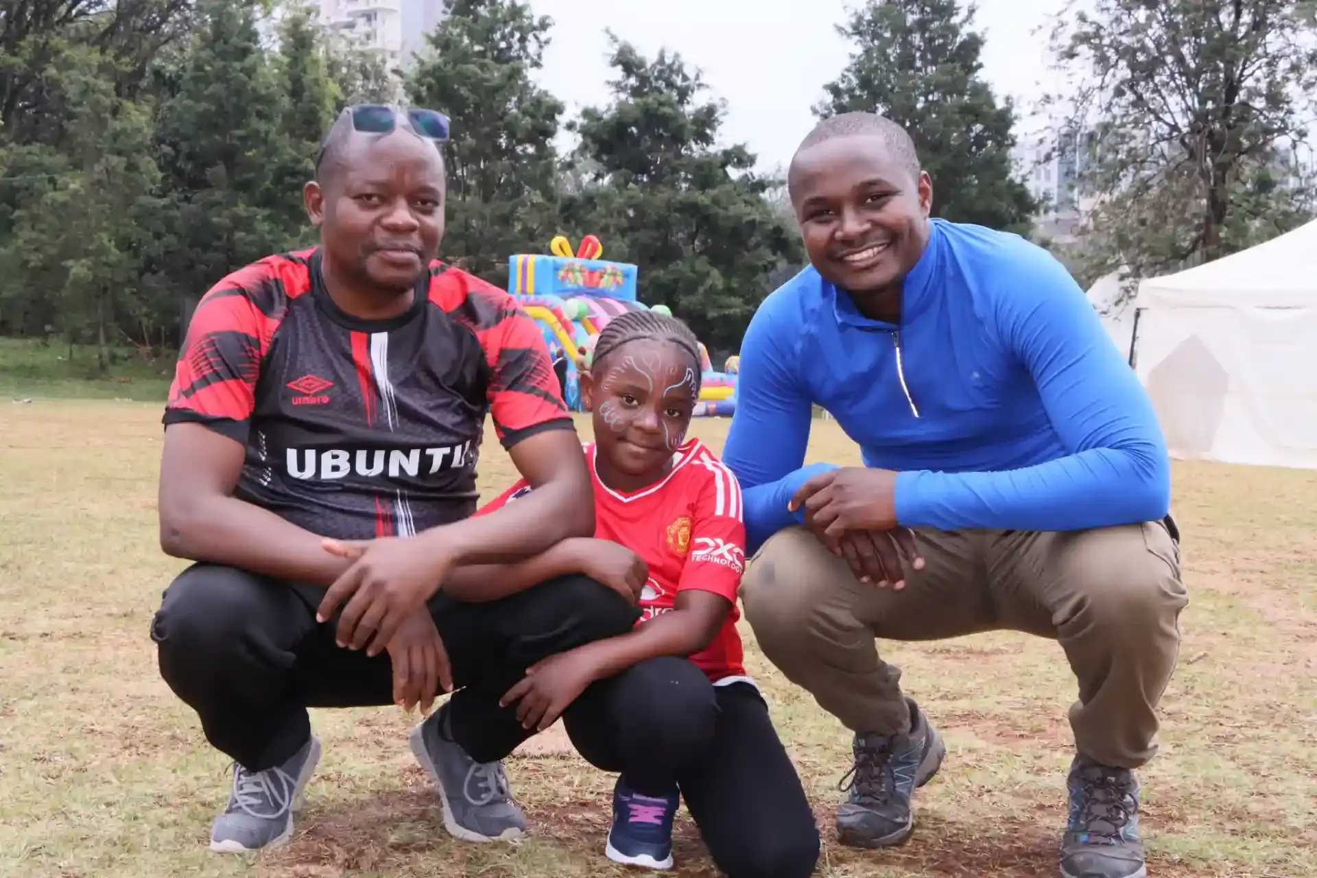 Two Mizizi Elimu community members smiling outdoors