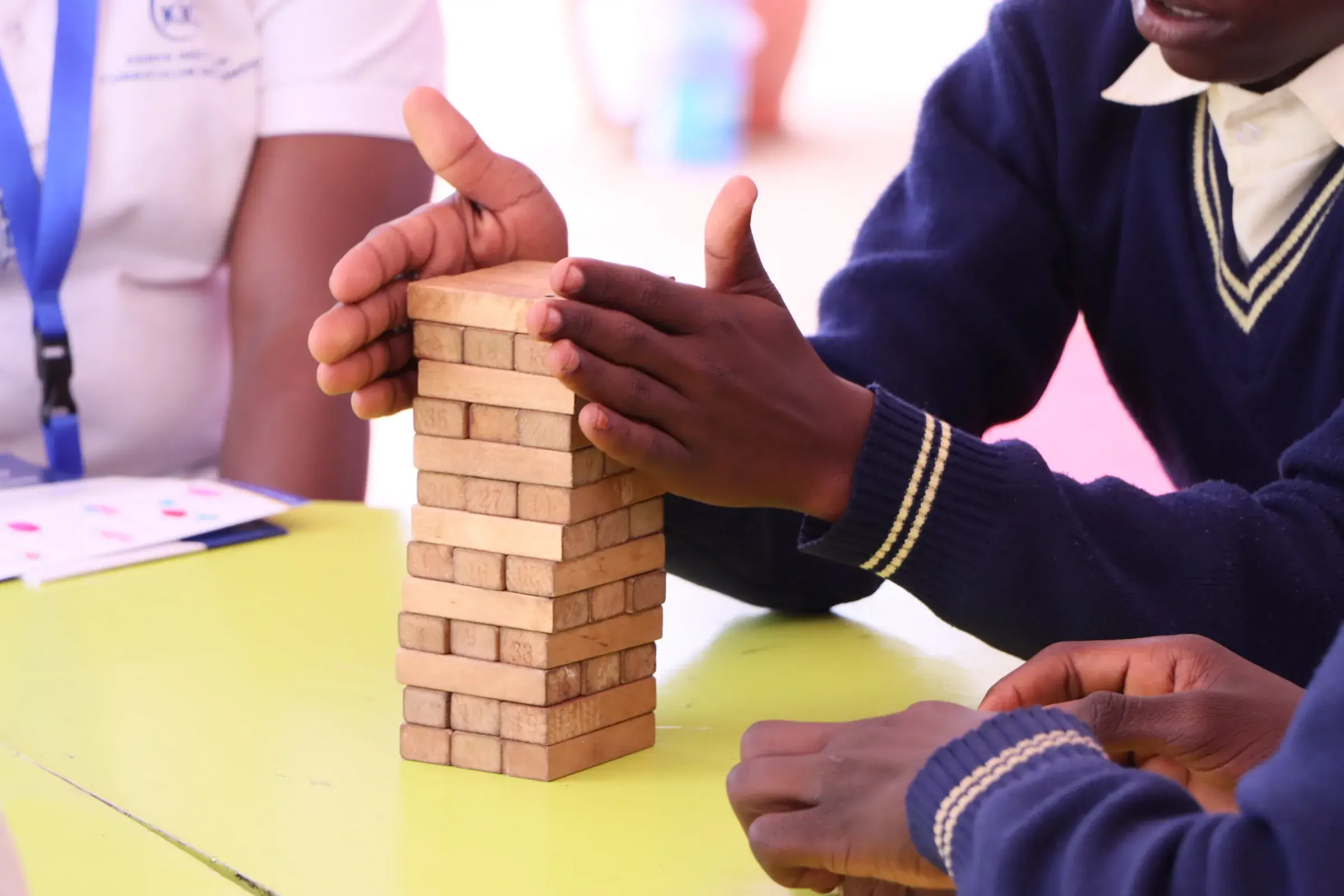 Children playing with wooden building blocks